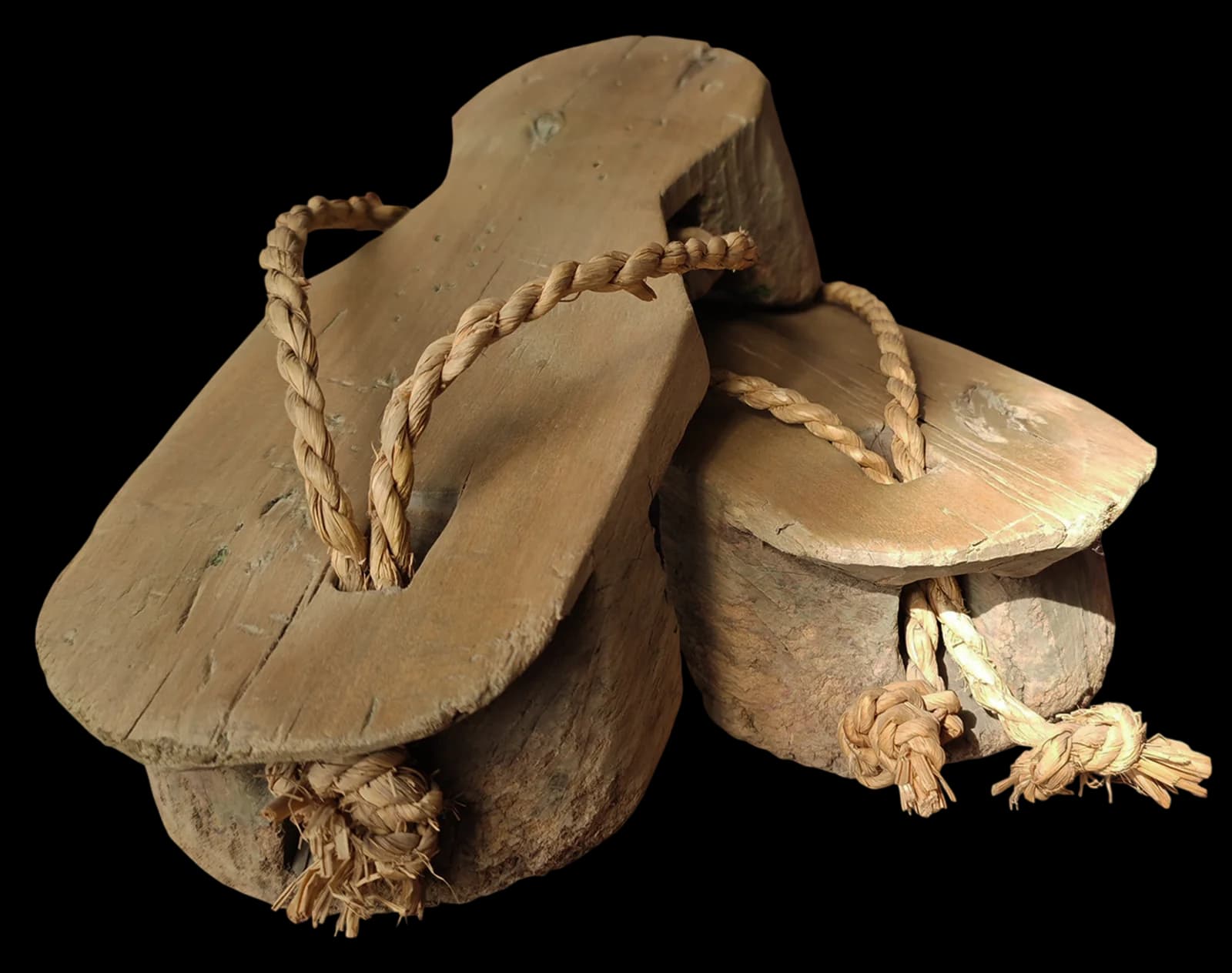 Traditional carved wooden sandals with rope straps